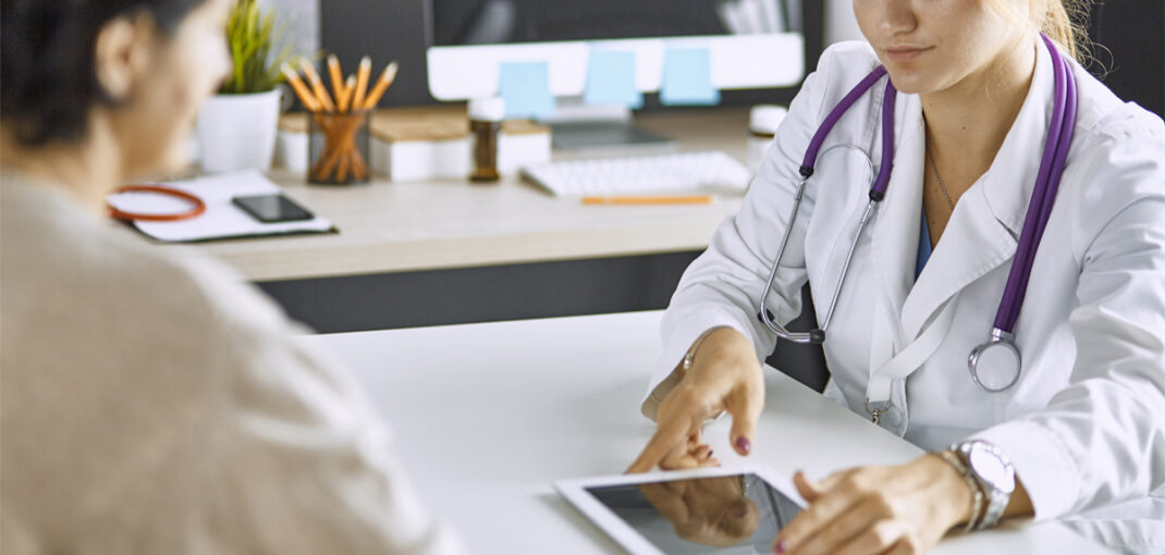 Woman learning about menopause treatment for women and hormonal wellness support