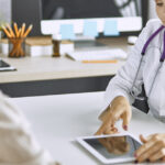 Woman learning about menopause treatment for women and hormonal wellness support